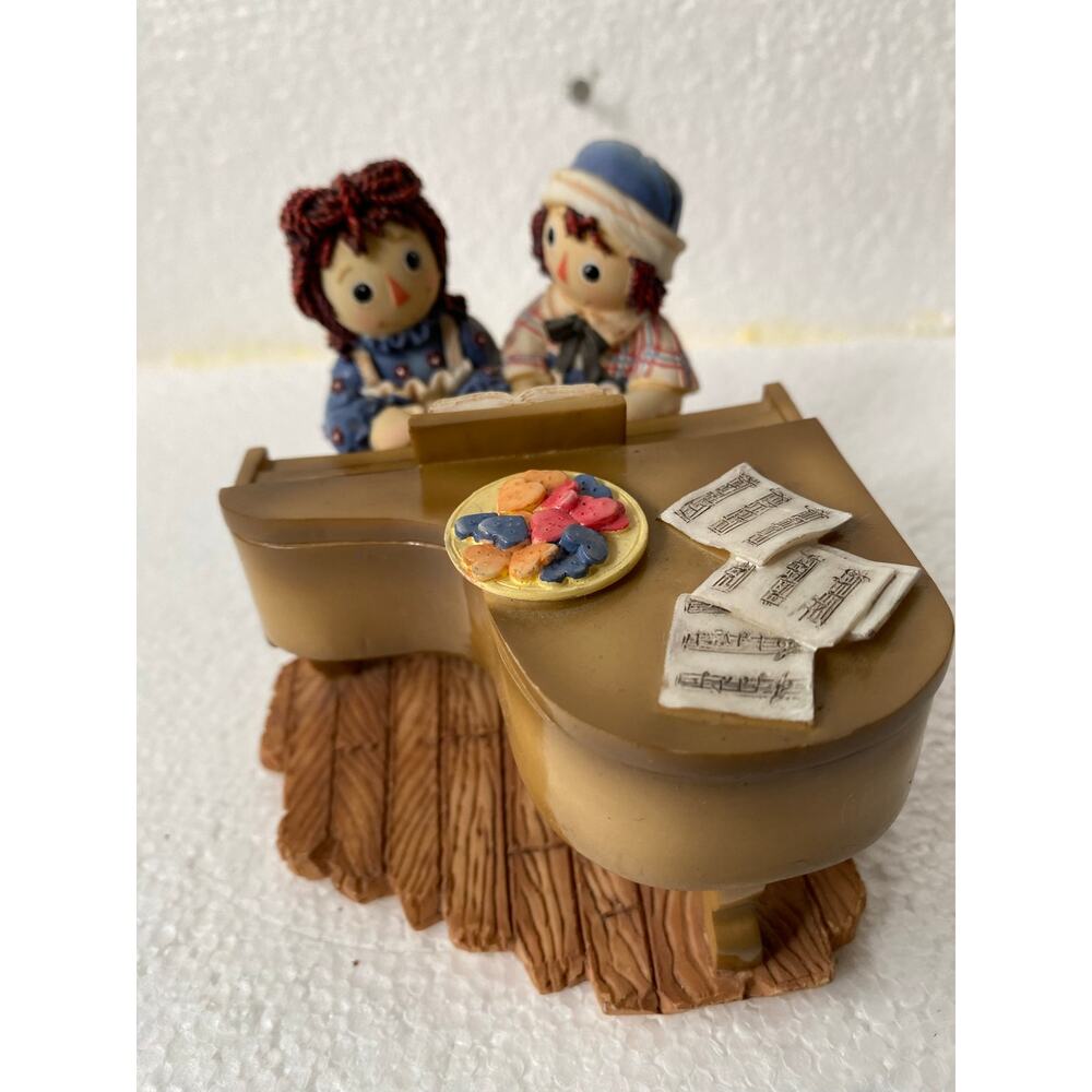 vintage Enesco Raggedy Ann & Andy "Everything Sounds Better We Play" figurine.